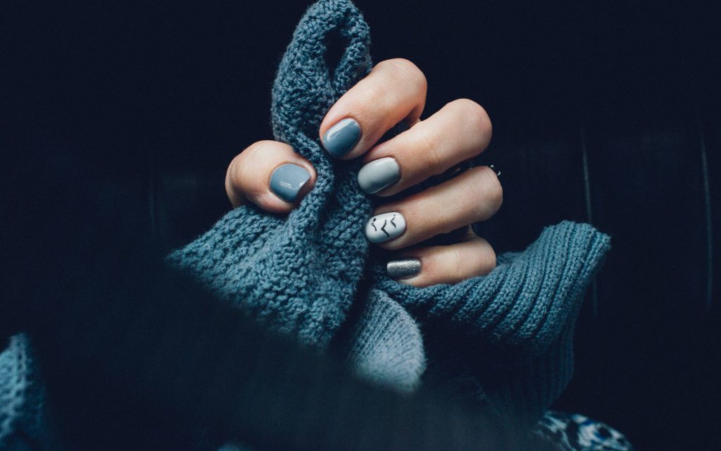 blue-knitted-clothing-and-nails-2567326